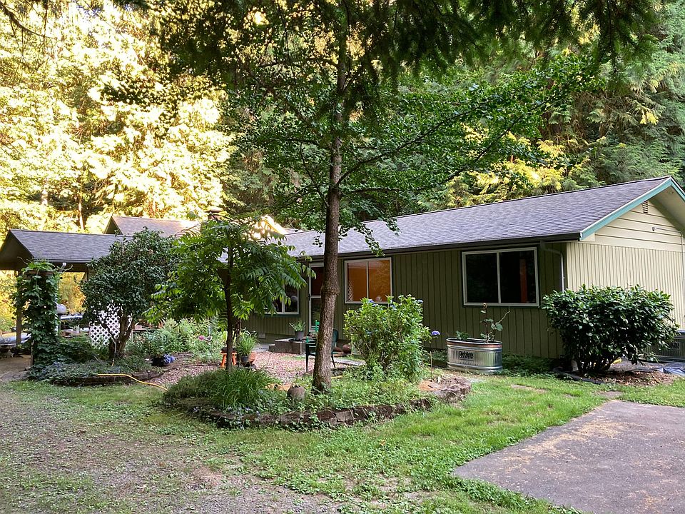 Carport for those rainy days. Basketball court. Large garden containers on sunny side. Still time for fall garden.