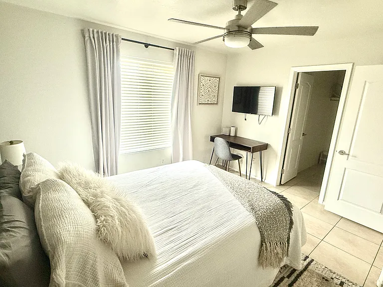 Queen Bedroom 1 with desk, TV, walk in closet
