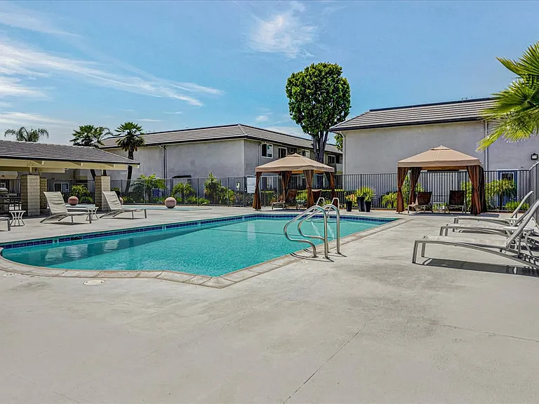Pool Views with Cabanas and Furniture