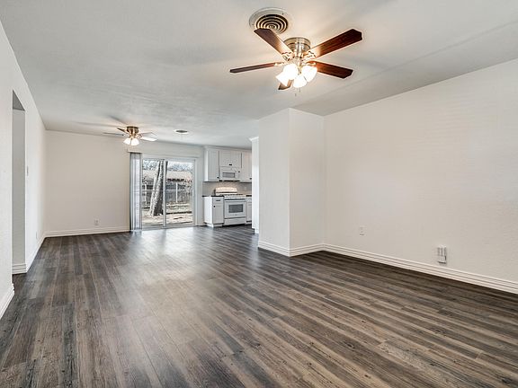 View from living room toward dinning room and sliding glass door to back yard