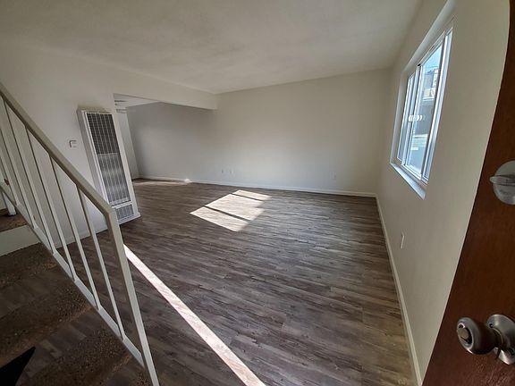 Entry to Living Room area 207" x 160"

Stairs are now black tile
