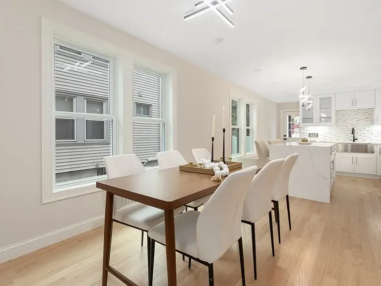 Perfect for hosting: The sun-lit dining area sits directly off the kitchen, making it easy to transition from meal prep to a sit-down dinner.