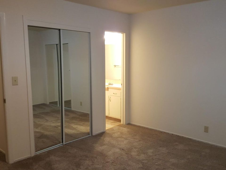 Bedroom with sliding mirrored doors