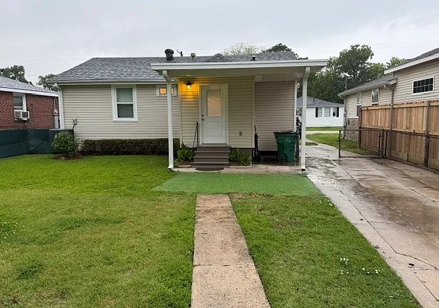 Rear yard access, fully fenced. Covered patio leads to inside laundry room.