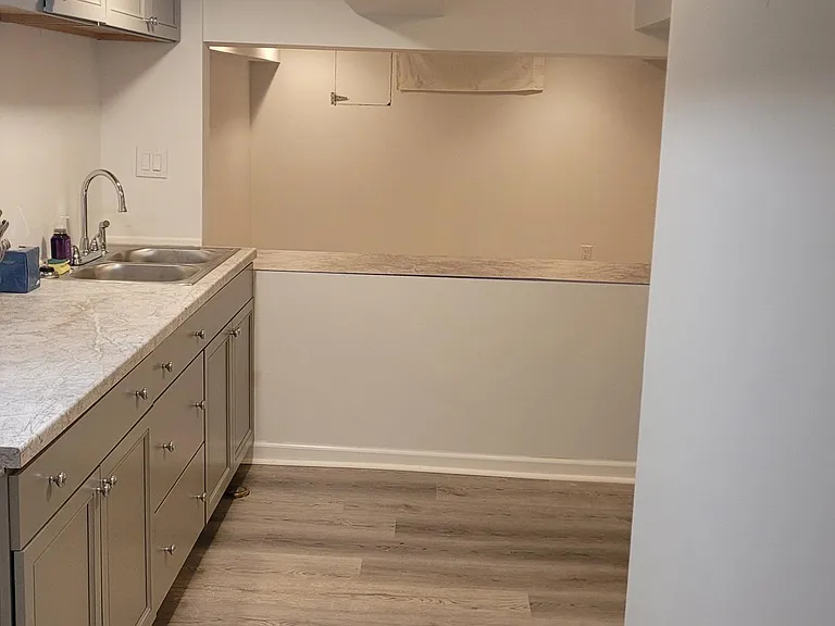 Clean space for food prep storage with plenty of outlets. And nook to eat at.