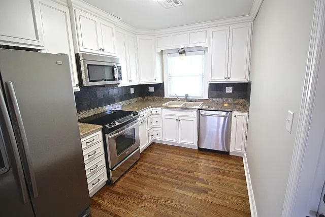 216 W 51st Terrace | Patio & Updated Kitchen — Photo 4
