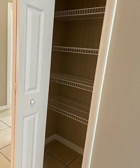 Linen closet located across from the guest bath