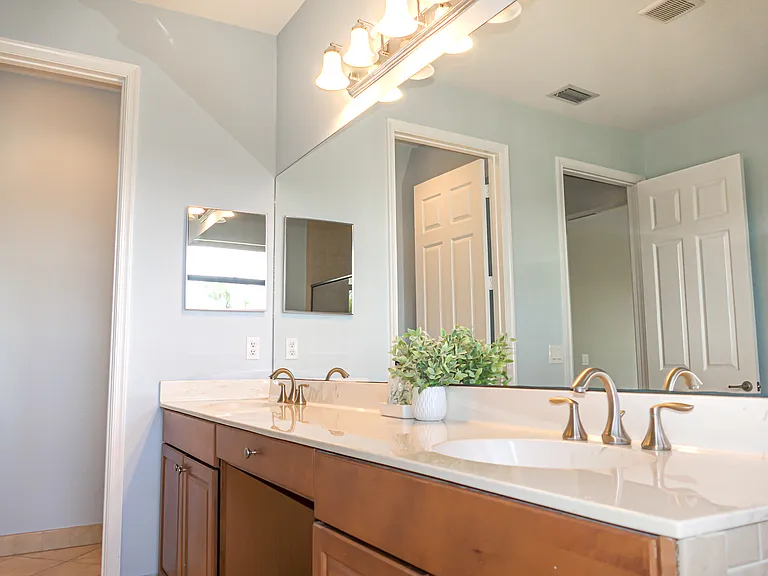 Double sink vanity in Master Bathroom. Private WC room in back of photo