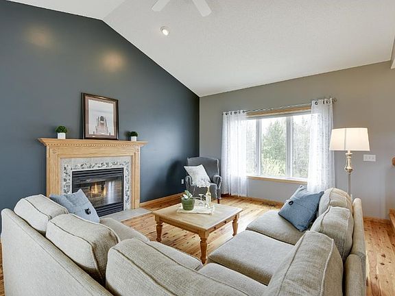 Enjoy all the light that is offered during any season in this lovely living room area.