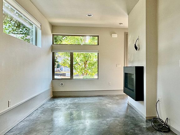 Living room gets southwesterly light. Ping the "5008 Fauntleroy" address to see a furnished mirror image of sister unit "A" (unit A is not available).