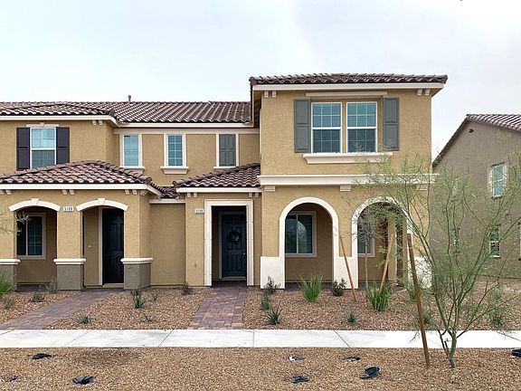 Townhome on a premium corner lot with lots of windows!