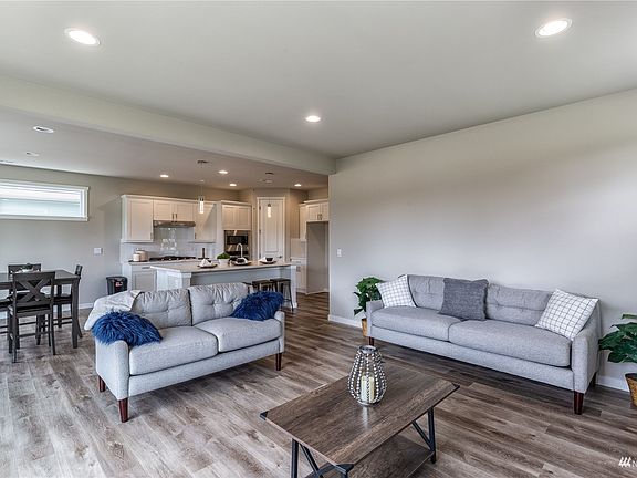 Photo is of the Model Home on Lot 1, the 2535 Sierra plan.  May depict enhancements and / or upgrades that are not available with every plan.>