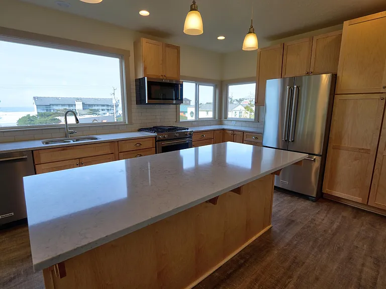 Kitchen with lots of cupboards and pantry area
