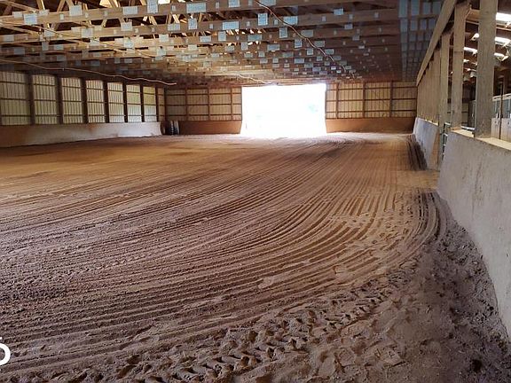 14,000 sqft Morton built equestrian barn complete with 7 12'x12' stalls, 2 12'x18' foaling stalls, 70' x 142' covered riding area, sprinkler / fly /lighting system