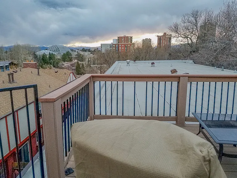Shared rooftop lounge area with mountain views