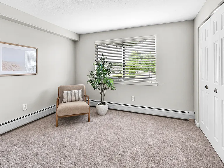 Indulge in the tranquility of our roomy bedroom, a restful oasis complete with a large closet containing built-in organizers for a tidy and relaxing environment.