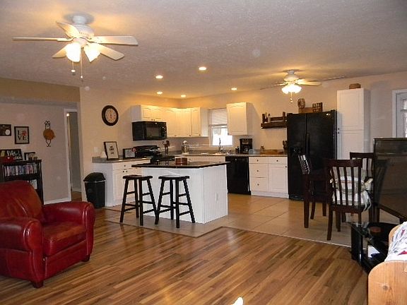 Laminate floor in kitchen, tile in kitchen