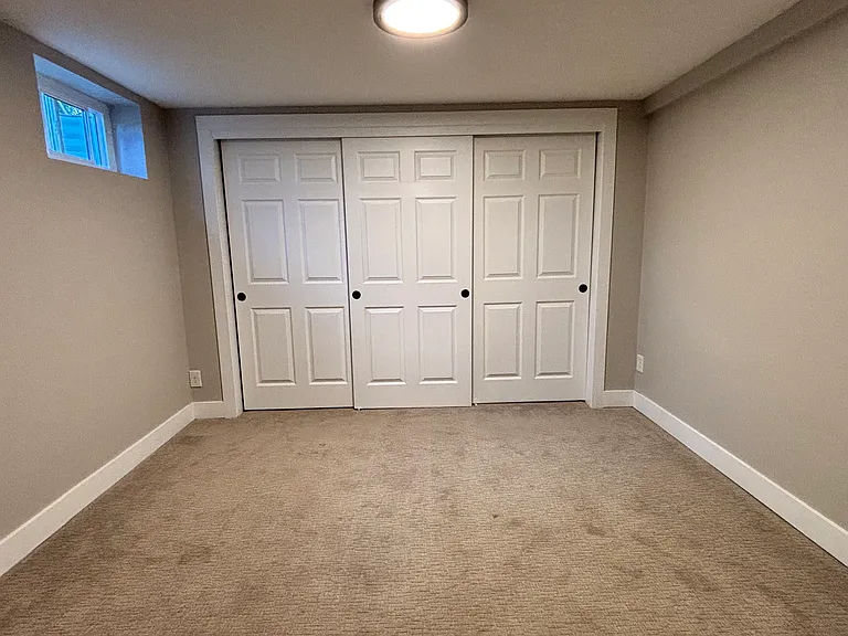Second bedroom or office space. Spacious area with wall-to-wall closet.