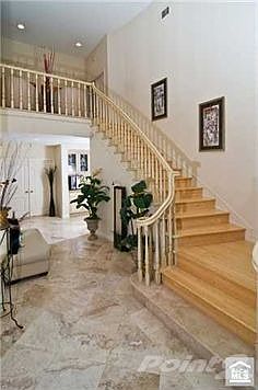 Dramatic entry and graceful staircase