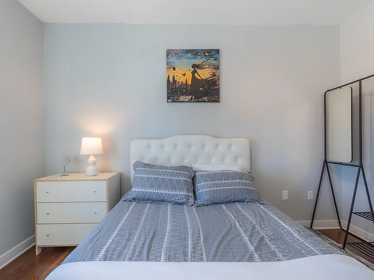 Furnished bedroom with a queen bed