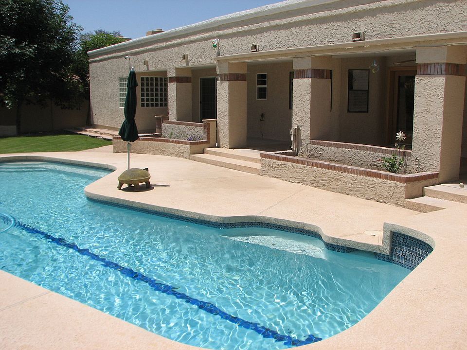 View of extended covered pation with pool