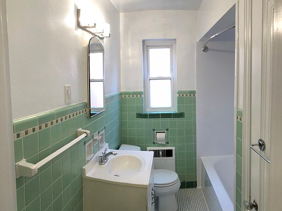 Updated bathroom with new shower and tile flooring. Large Linen closet is on the right. All new plumbing fixtures.