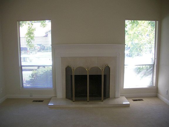 Living room with functional fireplace   High ceilings  Open 
