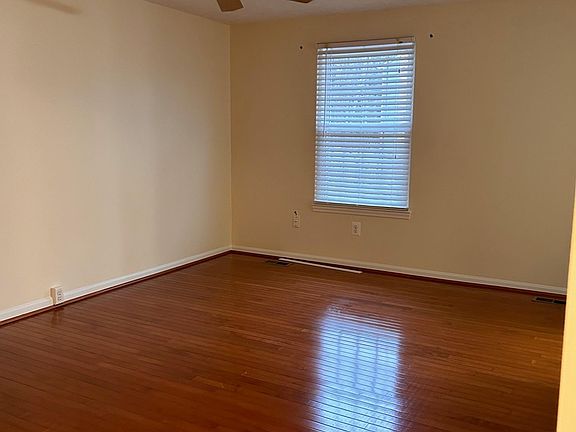 primary bedroom with wood floors