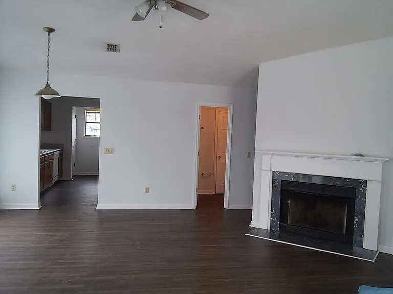 Nice spacious living area with wood burning fireplace