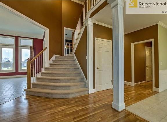recently refinished hardwood entry leads to open floor plan with