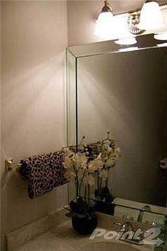 Powder room with beveled mirror and new commode