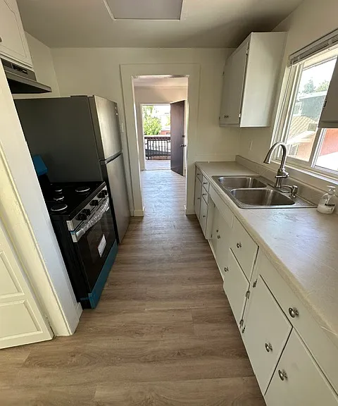 Kitchen with brand new stove and refrigerator