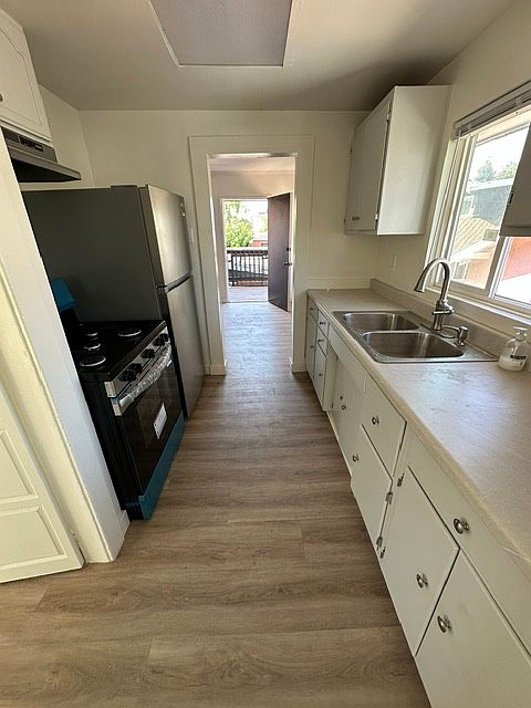Kitchen with brand new stove and refrigerator