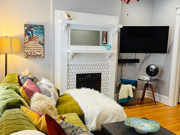 Whether you're hosting friends or enjoying a quiet evening in, this living room offers the perfect balance of style, charm, and functionality. A beautiful original wood burning fireplace add's beauty and character despite. It's unusable due to City req.