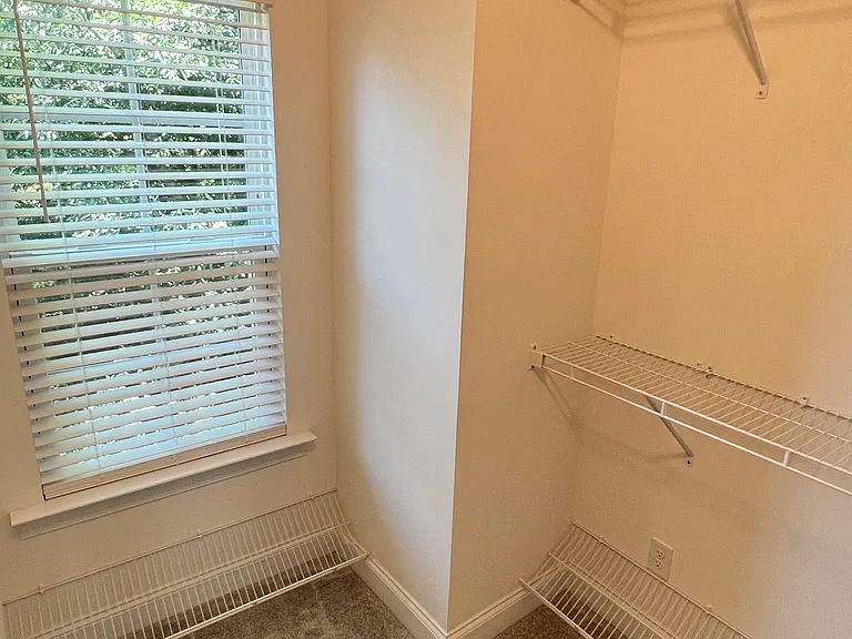 Upstairs master bedroom with walk-in closet and full bath featuring dual vanities.