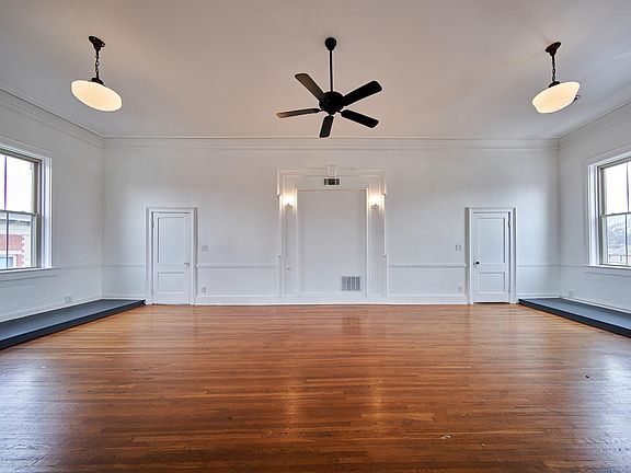 great room with hardwood floors multi ceiling fans historic ceiling globe lighting. wall lighting unbelievable space 8 oversize insulated windows with awesome views of up town westerville including otterbein college
no other space like this in uptown w