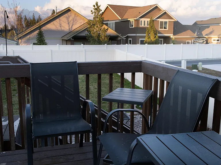 Photo of old deck but shows the deck furniture. 4 chairs and 2 small side tables