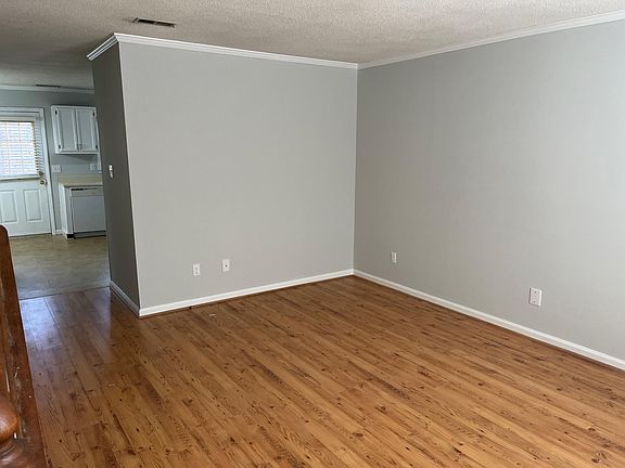 Living room leading to kitchen