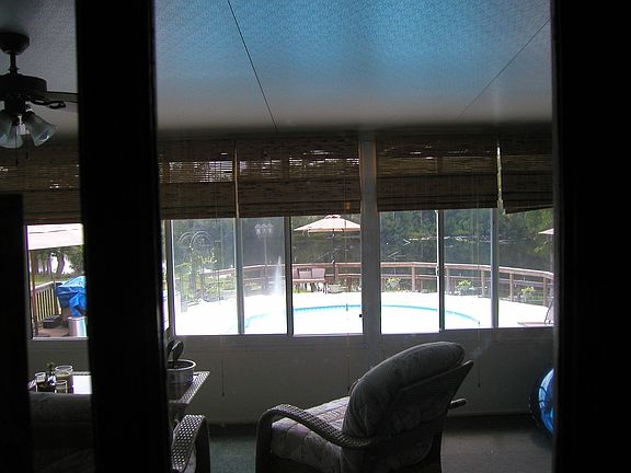 Sun Room and view of Pool and Lake