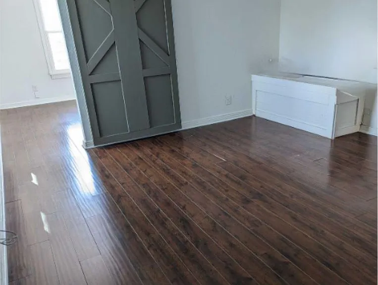 This is the view walking into the unit. To the left is the bedroom with barndoor.