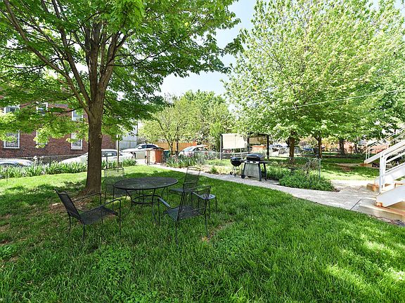 Lush and shady backyard, complete with space to grill.