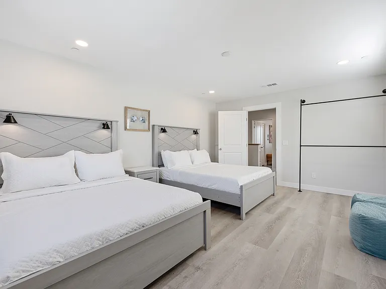 Bedroom 5 features a hanging rod for your belongings.