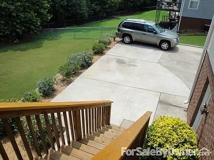Concrete driveway extended
						:
						Can easily park 3 cars or trucks without blocking garage doors.