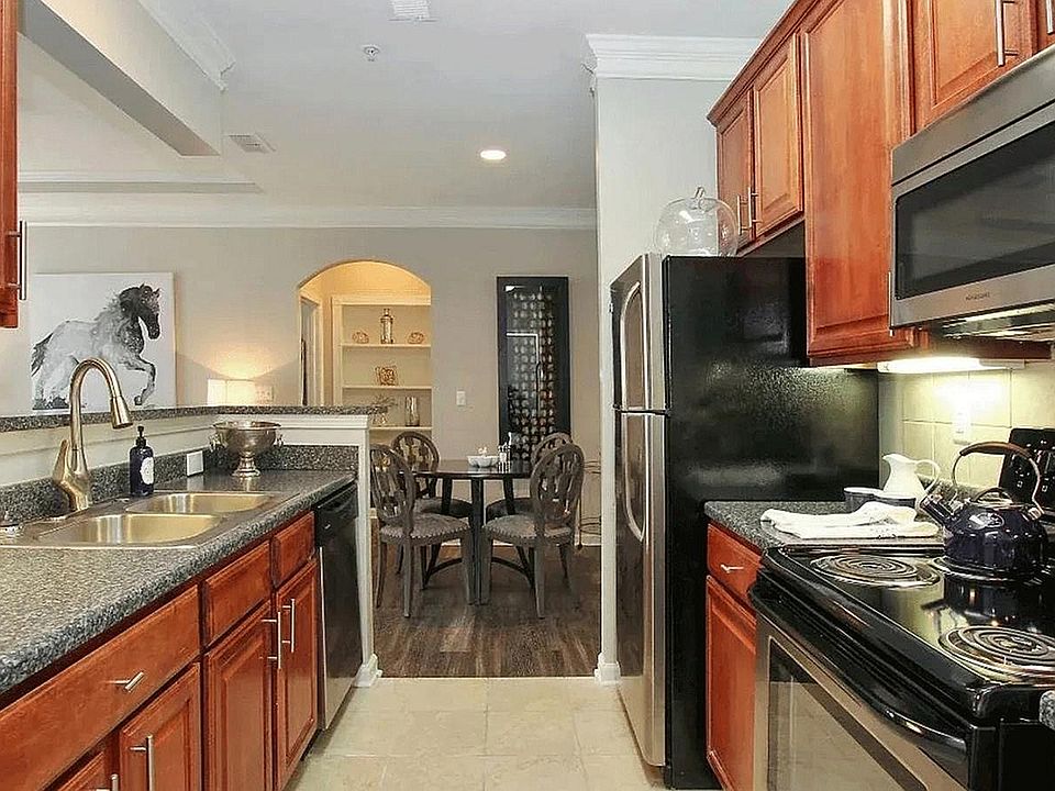 Experience the warmth and style of this beautifully designed kitchen, perfect for culinary adventures and intimate meals.