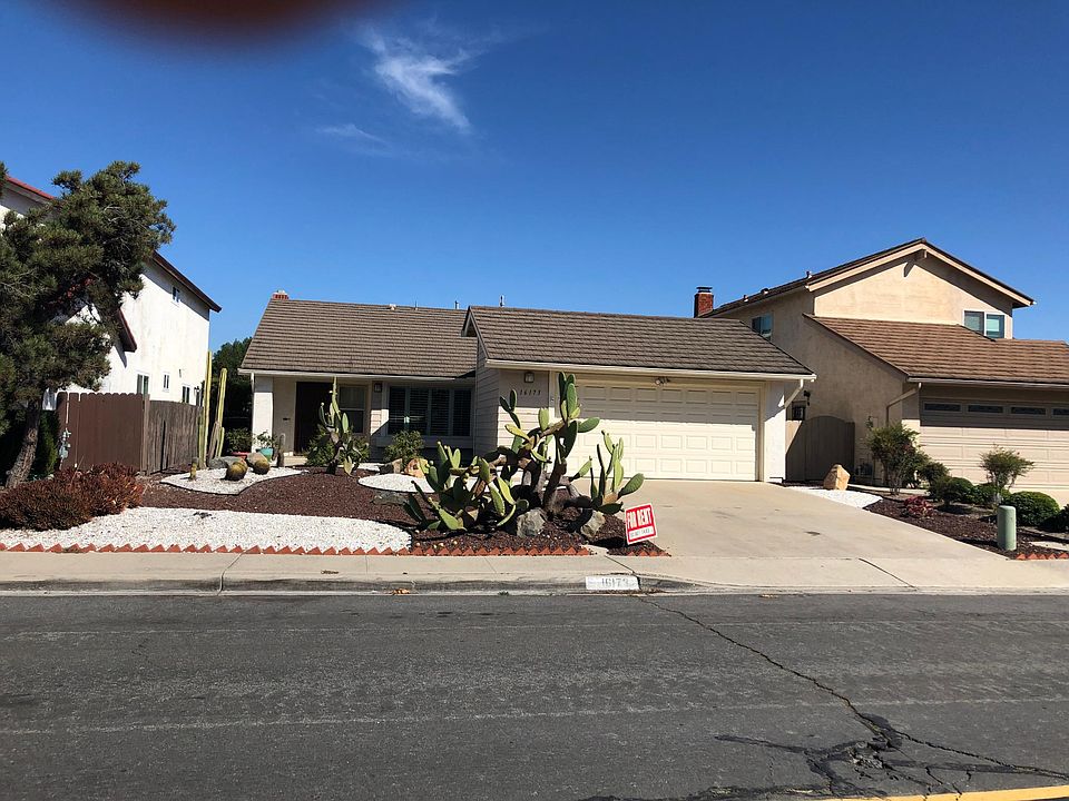 Front of house, low maintenance yard . Extra large garage with lots of storage space.