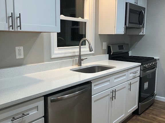 Whole new kitchen with quartz countertops, all new stainless steel appliances (microwave, stove, dishwasher), stylish new cabinets and new flooring.