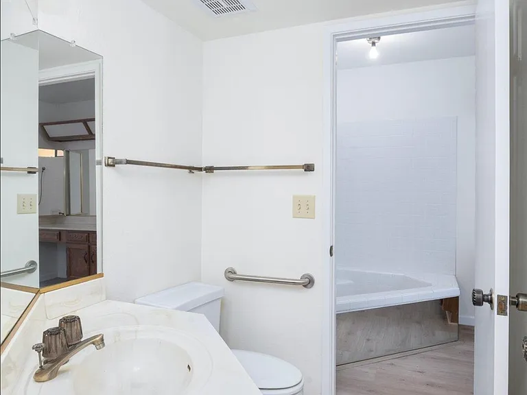 bathroom #2 
has tub/shower, separate sink and this Jack and Jill style room. It is also accessible from the hallway.