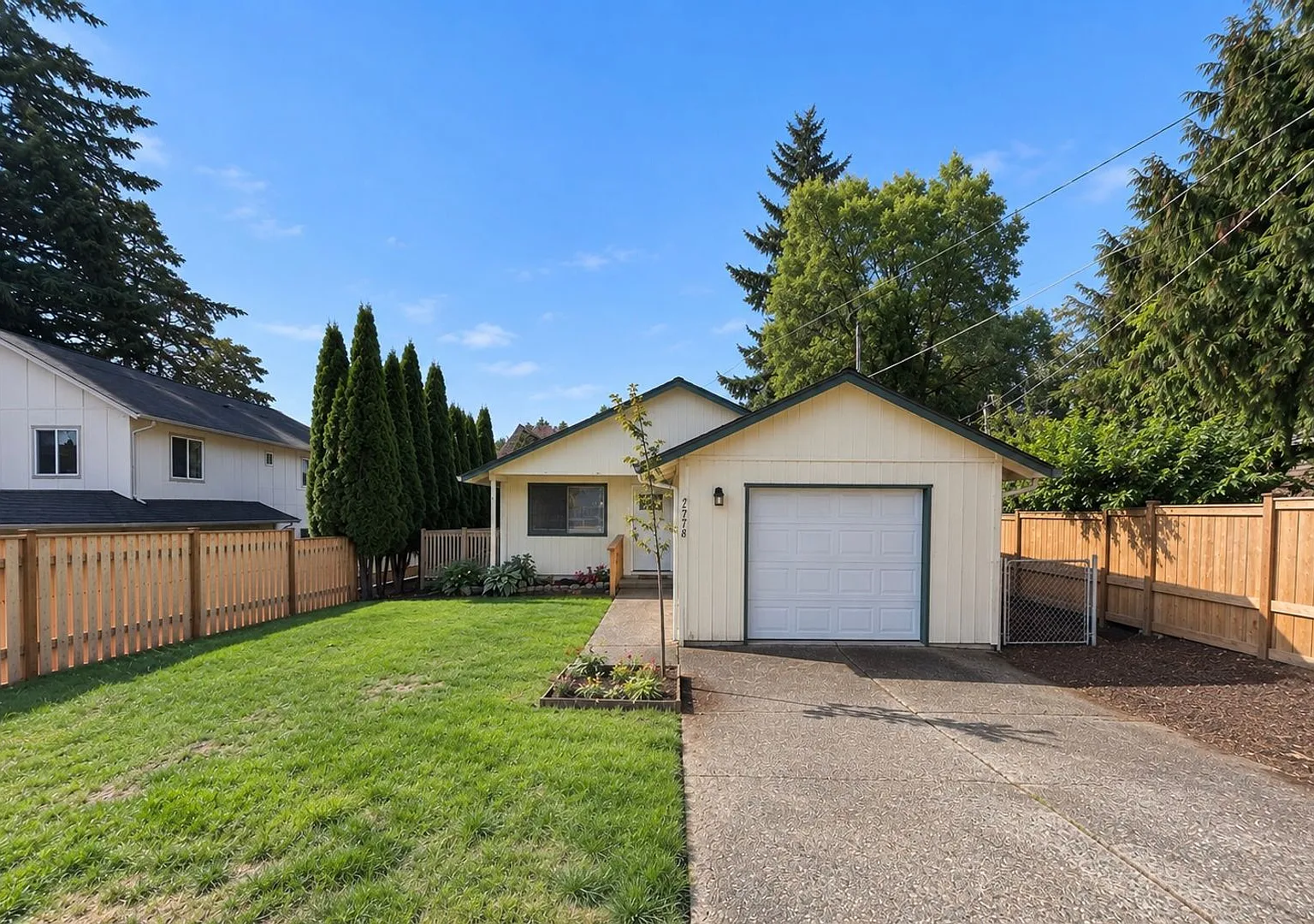 Freshly Updated 3 Bedroom Home with Garage, Fenced Yard & Spacious Balcony! — Photo 1