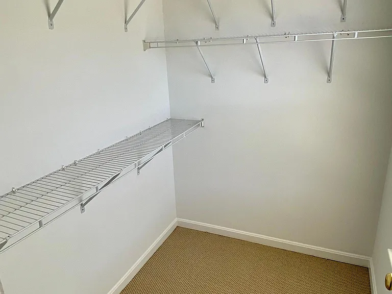 Walk-in closet in primary bedroom