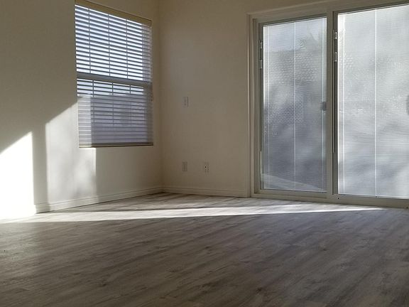 5. East-facing living room north end (with garden views + double glass sliding door with internal privacy blinds)